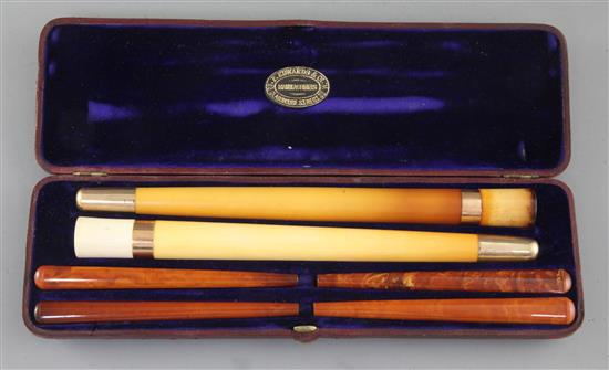 An Edwardian F. Edwards & Co of Glasshouse Street leather cased set of two gold banded meerschaum cigar 10.25in.